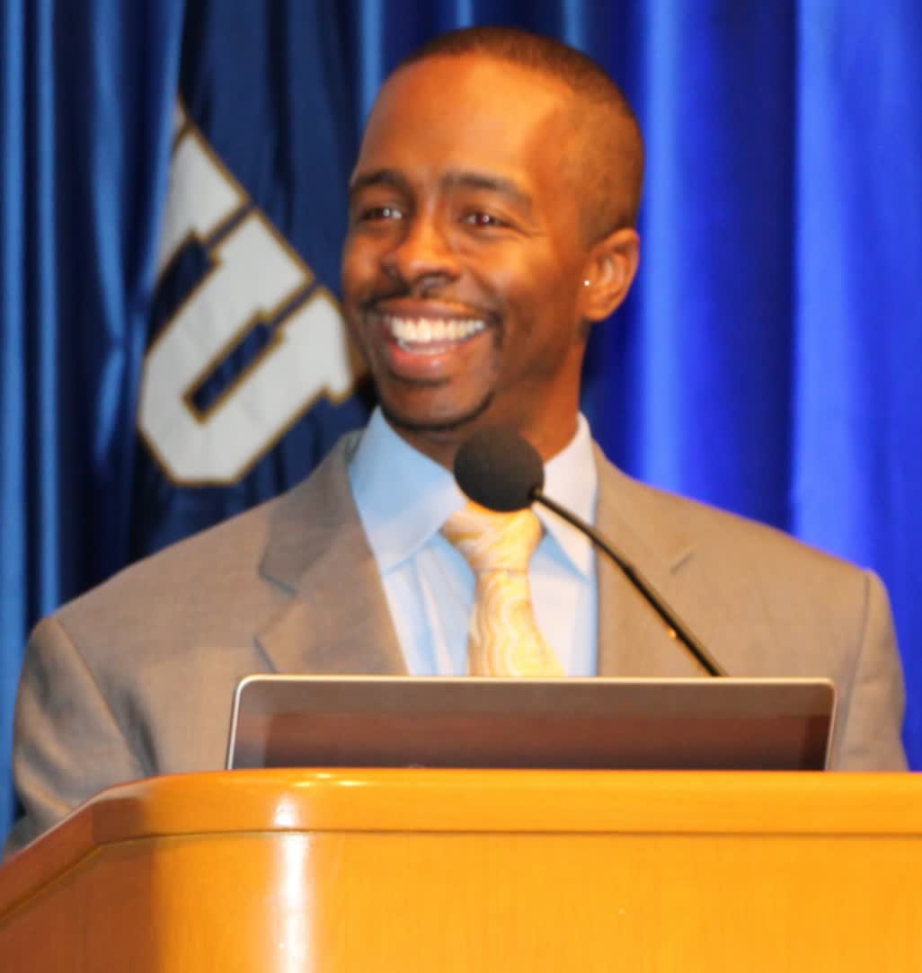 Dr. Marcus A. Huggans speaking